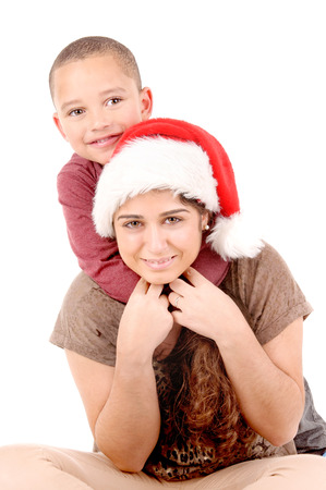 young woman with boy on christmas isolated in white backgroundの写真素材