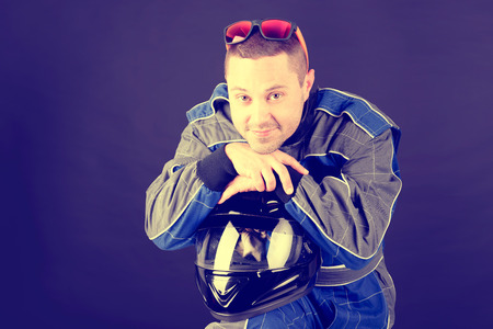 race driver isolated in dark backgroundの写真素材