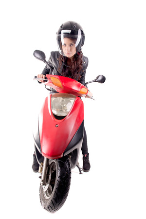 young woman with motorcycle isolated in whiteの写真素材