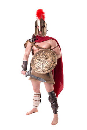 gladiator posing isolated in whiteの写真素材