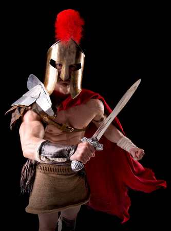 gladiator posing isolated in dark