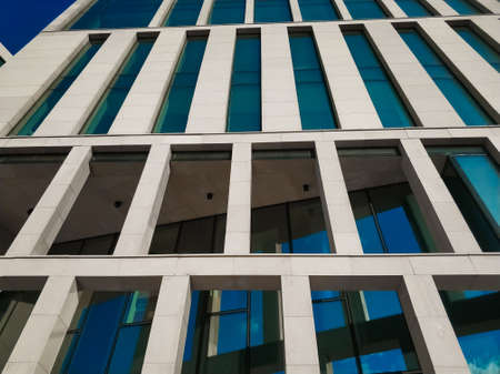 Modern business center. Blue windows. Facade of the building. Exterior of office building.のeditorial素材
