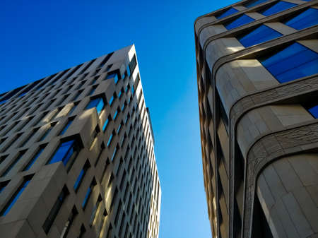 Modern business center. Blue windows. Facade of the building. Exterior of office building.のeditorial素材