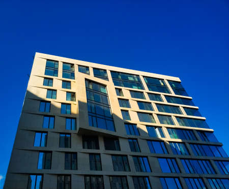 Modern business center. Blue windows. Facade of the building. Exterior of office building.のeditorial素材