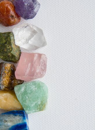 set of semiprecious stones on a white background, on a white textured canvas. natural backgroundの写真素材