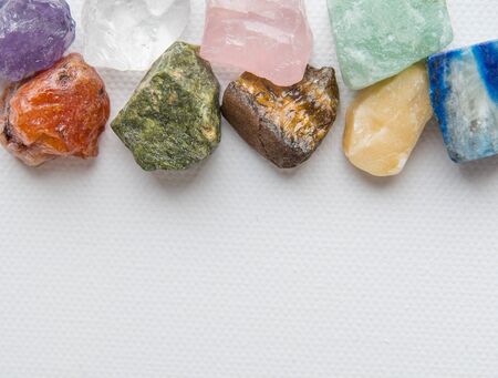 set of semiprecious stones on a white background, on a white textured canvas. natural backgroundの写真素材