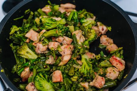 vegetables in a pan with fried chicken.の写真素材
