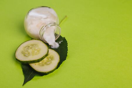 White cucumber cream on a yellow-green background.の写真素材