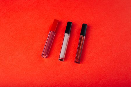 Cosmetics on a bright orange background.の写真素材