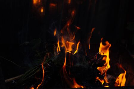 Flames on a dark background.の写真素材