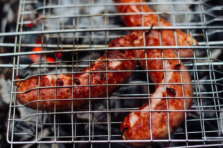 Grilled sausages on the grill. Sausages barbecue.の写真素材