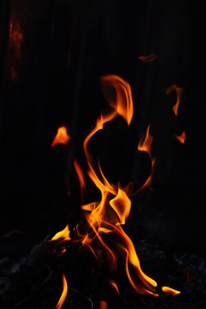 Flames on a dark background.の写真素材