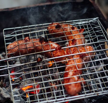 Grilled sausages on the grill. Sausages barbecue.の写真素材