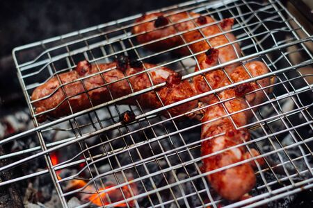 Grilled sausages on the grill. Sausages barbecue.の写真素材