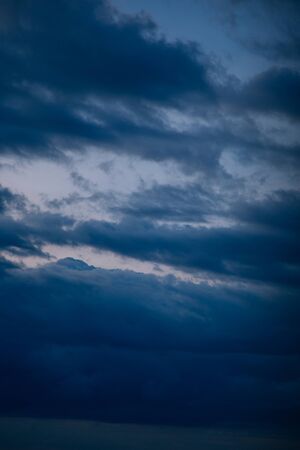 The texture of the clouds. Evening blue sky. get dark.