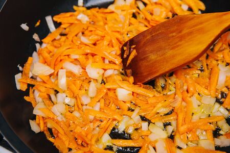 Fry with onions and carrots cook in a pan. Cooking . Vegetable stew.の写真素材