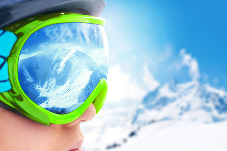 A mountain range reflected in the ski mask.Shallow depth of field.の写真素材