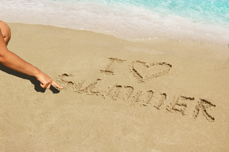 Inscription on wet sand I Love Summer. Concept photo of summer vacation.の写真素材