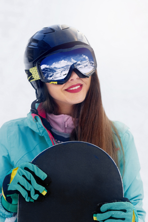 Close up Portrait of snowboarder in Carpathian Mountains, Bukovel Snowboarder. A mountain range reflected in the ski maskの写真素材