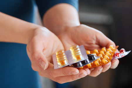 Vitamins And Supplements. Closeup Of Woman Hands Holding Variety Of Colorful Vitamin Pills. Close-up Handful Of Medication, Medicine Tablets, Capsules. Healthy Diet Nutrition Concept.の写真素材