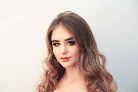Beautiful model girl with Fashion Luxury Makeup, long eyelashes, perfect skin facial make-up. Beauty Brunette model woman holiday make up close up. Eyelash extensions, false eyelashes. Beauty Woman.の写真素材