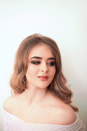 Beautiful model girl with Fashion Luxury Makeup, long eyelashes, perfect skin facial make-up. Beauty Brunette model woman holiday make up close up. Eyelash extensions, false eyelashes. Beauty Woman.の写真素材