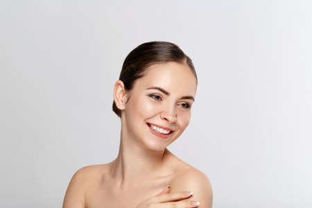 Face massage. Close-up of young woman getting spa massage treatment at beauty spa salon.Spa skin and...