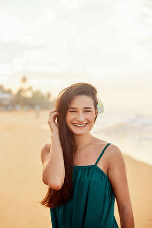 Happy woman on beach. beautiful girl. Young pretty girl. smiling woman portrait.の写真素材