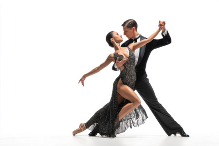 Dynamic duo showcases their remarkable tango skills wearing sophisticated outfits, captivating the audience with their grace and intensity in a dance competition setting.の素材