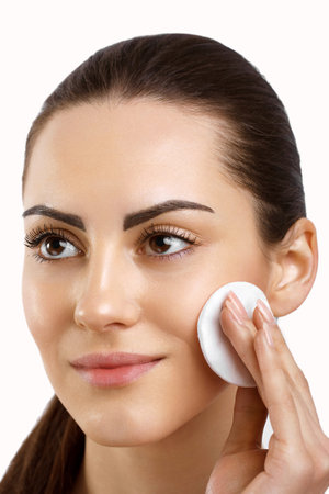 Beauty Face. Beautiful Woman With Natural Makeup.Skin Care. Woman Removing Face Makeup With Cotton...