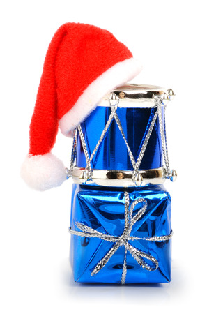 Christmas drums, baubles, toys and christmas hat isolated on whiteの写真素材