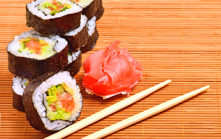 sushi, rolls, ginger and chopstick on bamboo matの写真素材