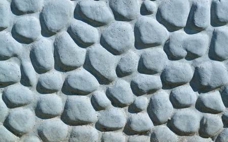 Background made of a closeup of a wall with pebblesの写真素材