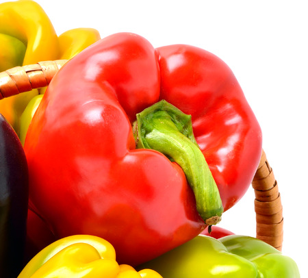 Sweet pepper in the basket isolated on whiteの写真素材