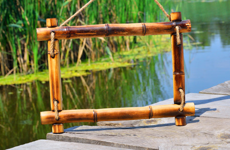 Bamboo frame on the river backgroundの写真素材