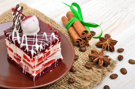 Delicious cake with chocolate and cherry on background sackingの写真素材