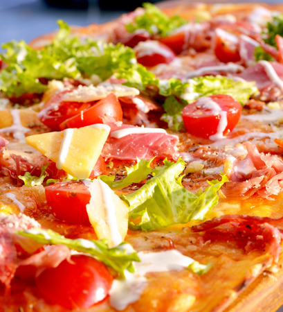 Tasty pizza on wooden boardの写真素材