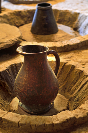 Ancient jug of wine in the wine cellar.の写真素材