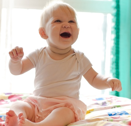 Portret of little laughing girlの写真素材