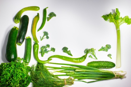 Fresh green vegetables isolated on whiteの写真素材