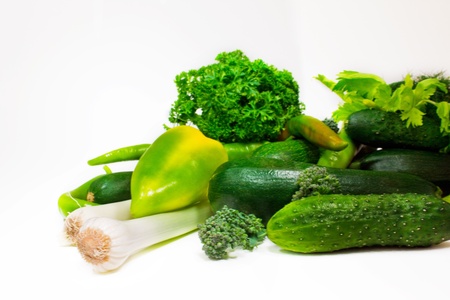 Fresh green vegetables isolated on whiteの写真素材