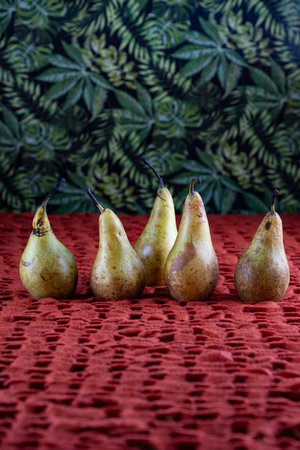 Ripe pears on a red napkin. Selective focus.の写真素材