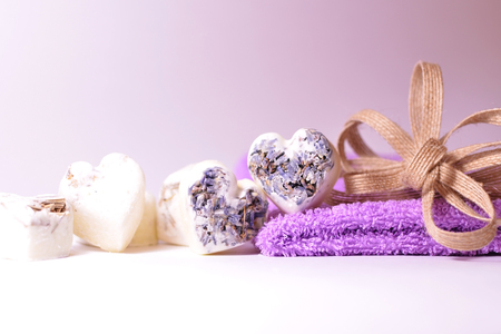 Spa lavender soap hearts with violet towel and flax ribbon bowの写真素材