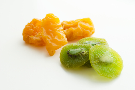 dry kiwi and pear fruits snak isolated over white backgroundの写真素材