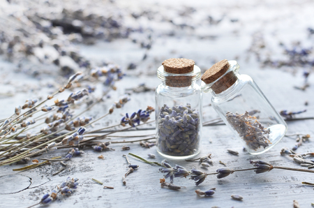 dry lavender flowers and buds over wooden backgroundの写真素材