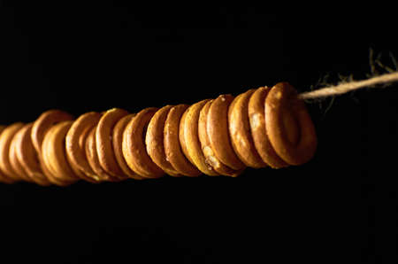 Traditional russian bagels on a rope on black backgroundの写真素材