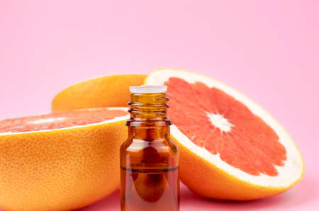 Citrus pure essential oil in glass bottle, aromatherapy or alternative medicine treatment.の写真素材