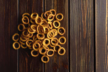 Traditional russian small bagels on dark rustic table background, top view, copy spaceの写真素材