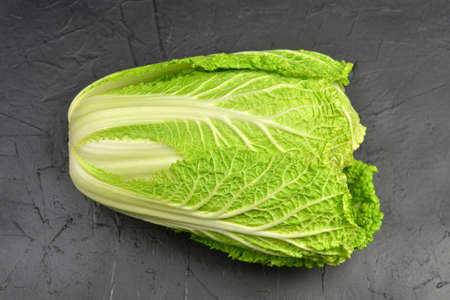 Napa or chinese cabbage head on black background.の写真素材