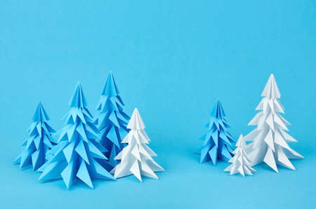 Blue and white paper origami christmas trees. Christmas and New year concept.の写真素材